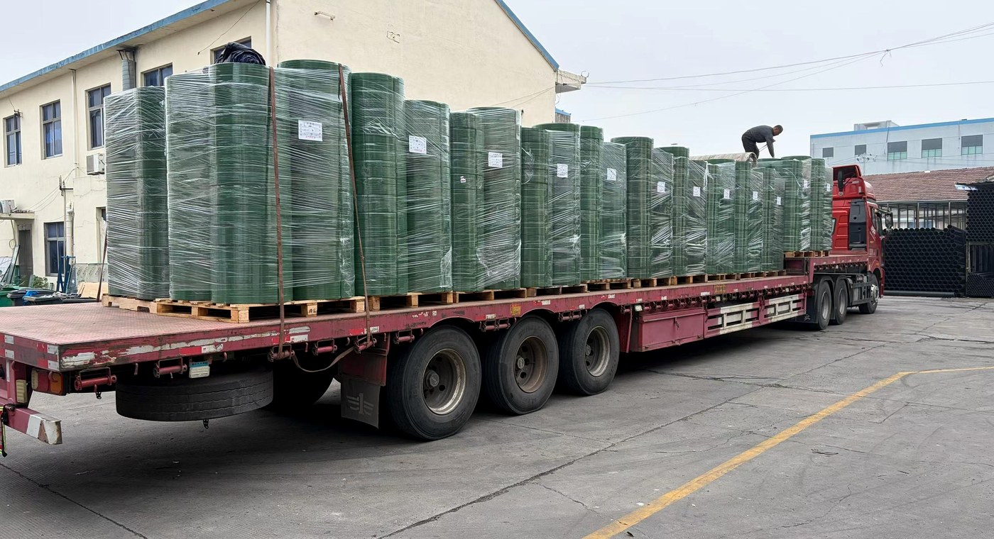 Truck loaded with wrapped PET strapping coils for logistics shipment planning
