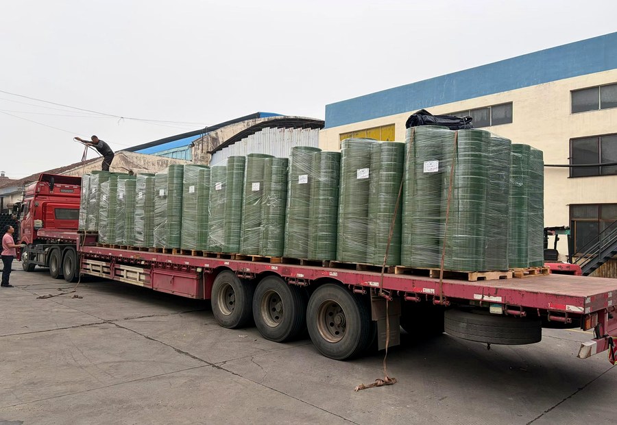 PET strapping coil shipment prepared for building material unitization review